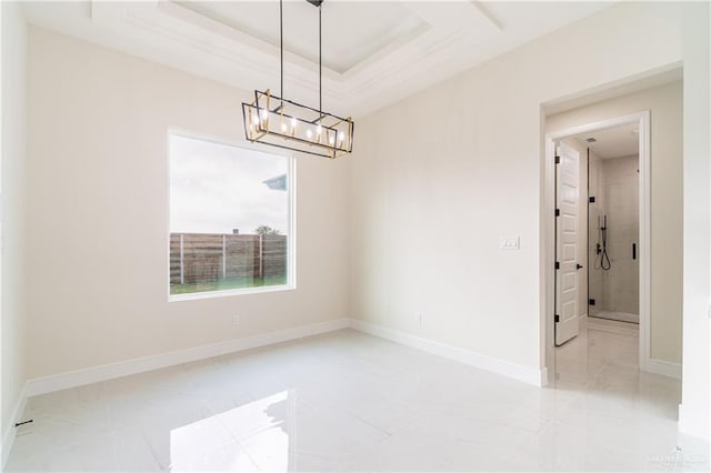 1608 Diplomat Dr, Edinburg, TX 78542 - spare room with a chandelier, baseboards, light tile patterned flooring, and a tray ceiling
