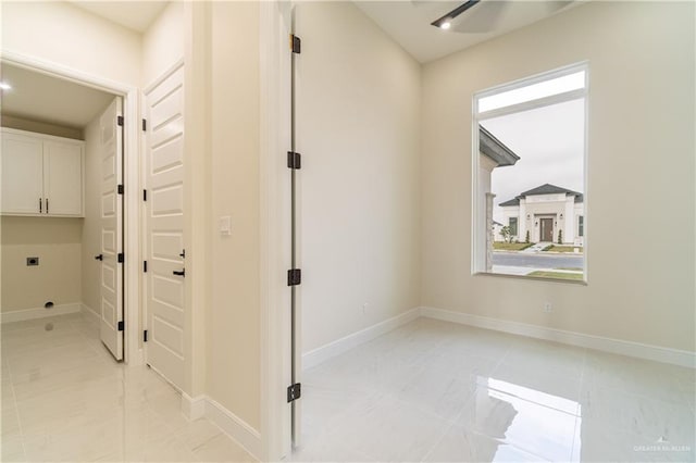 1608 Diplomat Dr, Edinburg, TX 78542 - hallway featuring light marble finish floors and baseboards