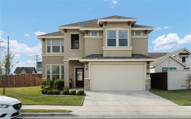 prairie-style home featuring a front yard and a garage