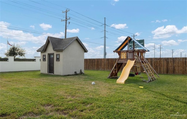 view of jungle gym featuring a shed and a lawn