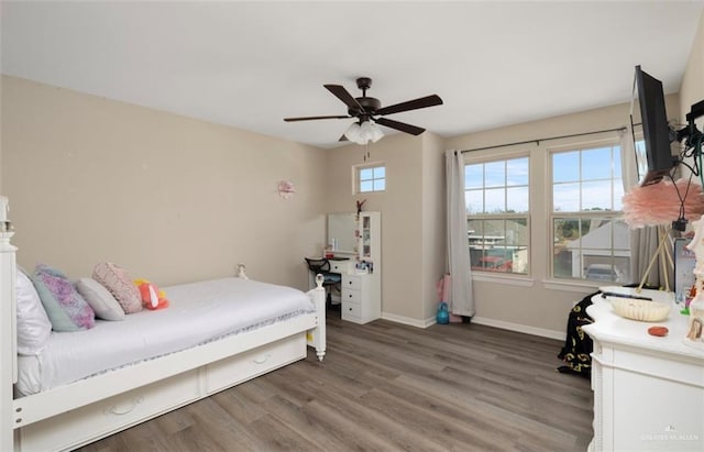 bedroom with hardwood / wood-style floors and ceiling fan