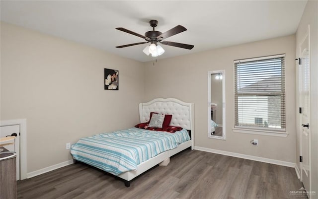 bedroom featuring ceiling fan and dark wood-type flooring