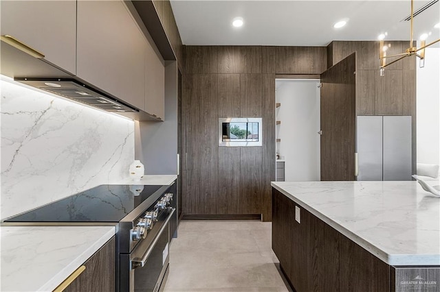 4916 N 26th St, Mcallen, TX 78504 - kitchen featuring stainless steel range, modern cabinets, light stone counters, dark brown cabinetry, and recessed lighting