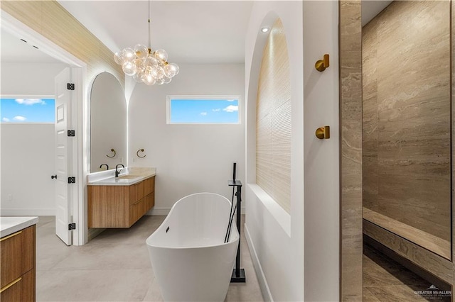 4916 N 26th St, Mcallen, TX 78504 - bathroom with vanity, a freestanding bath, and a chandelier