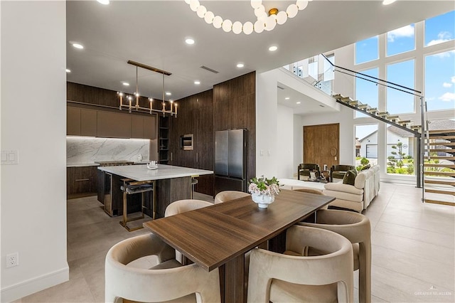 4916 N 26th St, Mcallen, TX 78504 - dining room featuring stairs, recessed lighting, a towering ceiling, and a chandelier