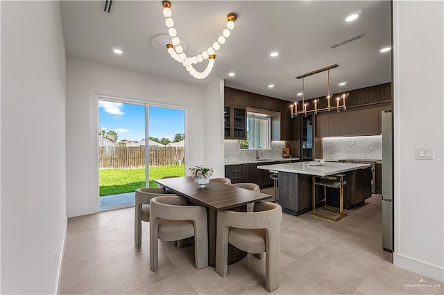 4916 N 26th St, Mcallen, TX 78504 - dining space featuring a chandelier, baseboards, and recessed lighting