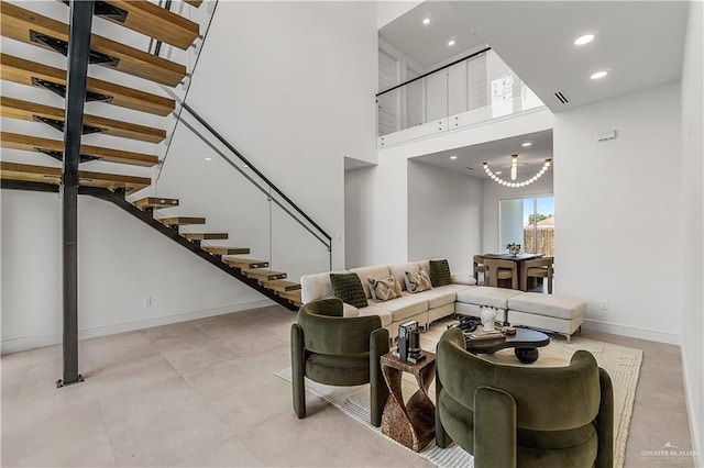 4916 N 26th St, Mcallen, TX 78504 - living room with stairway, baseboards, recessed lighting, a towering ceiling, and a chandelier