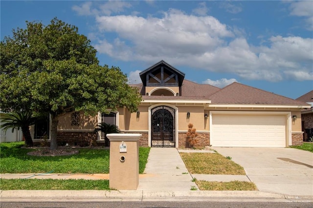 view of front facade featuring french doors and a garage