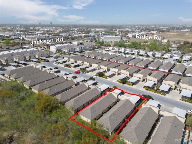 birds eye view of property with a residential view