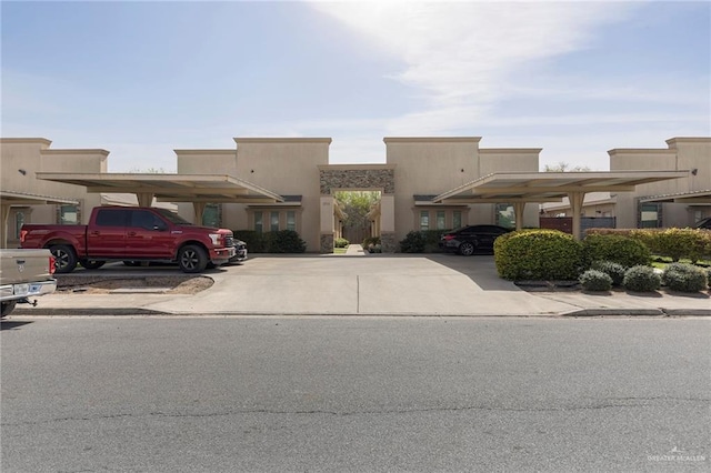 view of front of home featuring covered parking