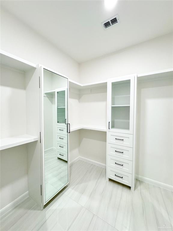 spacious closet with visible vents