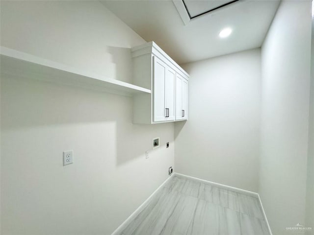 washroom with baseboards, recessed lighting, cabinet space, washer hookup, and hookup for an electric dryer