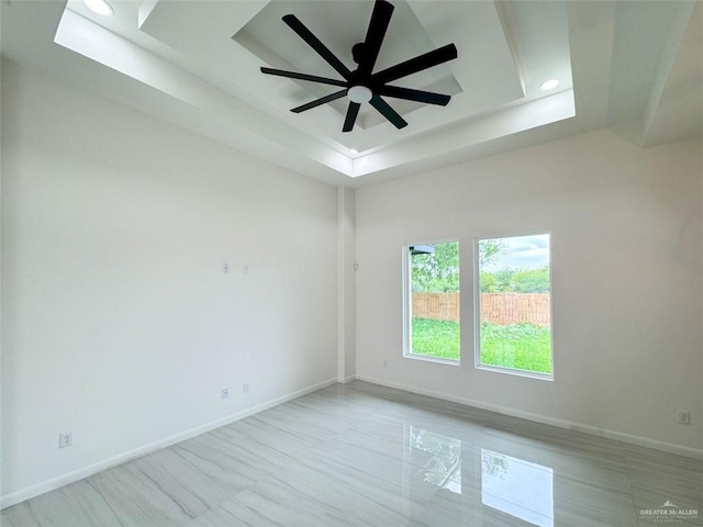 spare room with a raised ceiling, baseboards, a ceiling fan, and recessed lighting