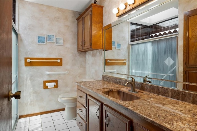 1923 Tyler St, Mission, TX 78572 - bathroom featuring vanity, toilet, tile patterned flooring, an enclosed shower, and baseboards