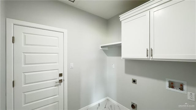 washroom featuring hookup for a washing machine, baseboards, hookup for an electric dryer, cabinet space, and marble finish floor