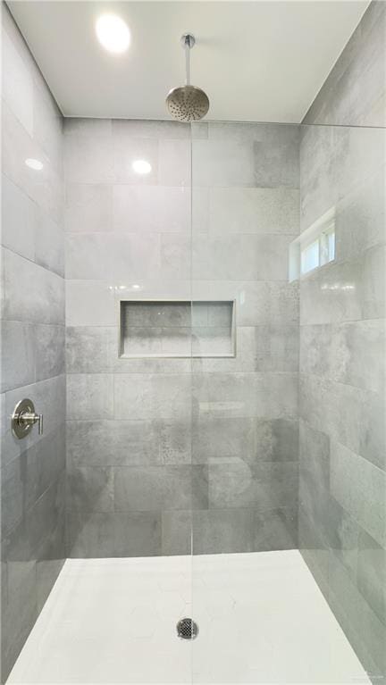 full bathroom with a tile shower