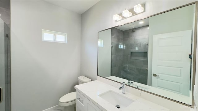 bathroom featuring baseboards, toilet, a stall shower, and vanity