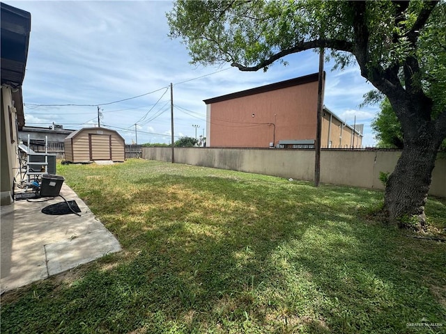 view of yard with a shed and a patio