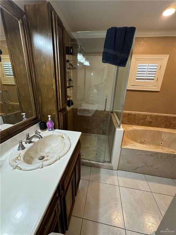 bathroom featuring tile patterned flooring, vanity, separate shower and tub, and ornamental molding