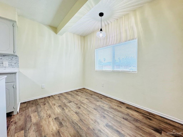 unfurnished dining area with light hardwood / wood-style floors