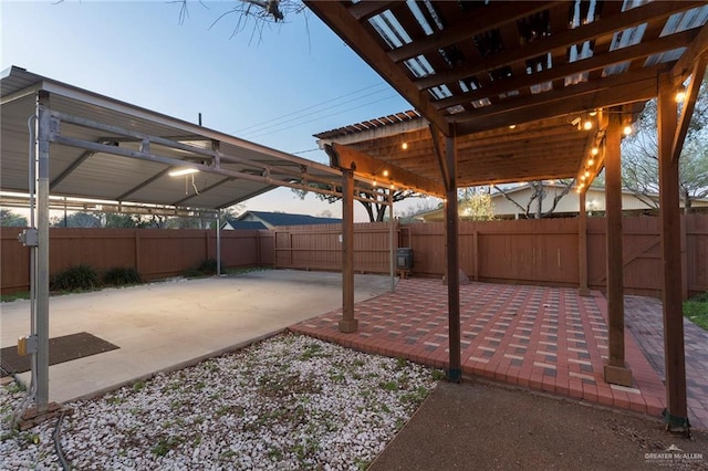 view of patio terrace at dusk