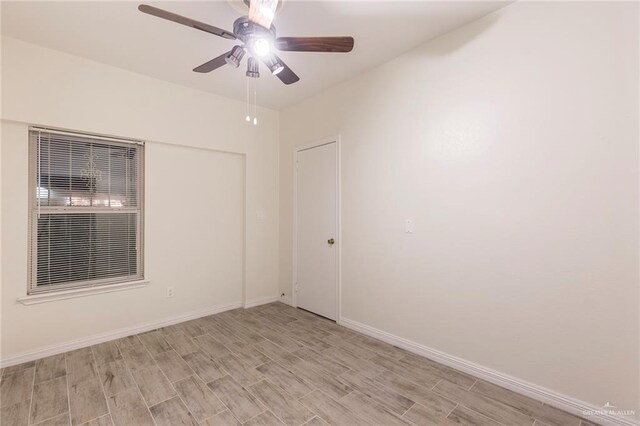 unfurnished room with light hardwood / wood-style floors and ceiling fan