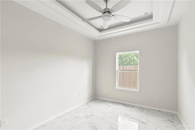 4313 Xenops Ave, Mcallen, TX 78504 - unfurnished room with light marble finish floors, baseboards, and a tray ceiling