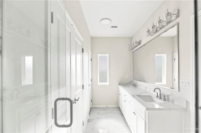 4313 Xenops Ave, Mcallen, TX 78504 - bathroom with marble finish flooring, baseboards, double vanity, and a stall shower