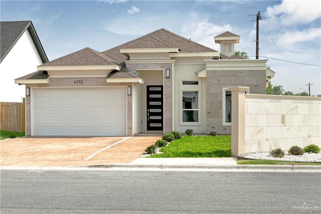 4313 Xenops Ave, Mcallen, TX 78504 - view of front of property with roof with shingles, an attached garage, stucco siding, and concrete driveway