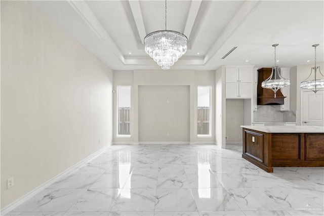 4313 Xenops Ave, Mcallen, TX 78504 - kitchen featuring a chandelier, a raised ceiling, recessed lighting, light countertops, and white cabinets