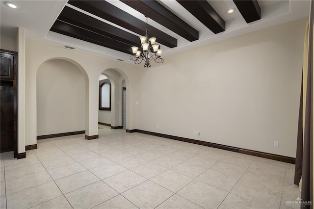 empty room featuring light tile patterned floors, arched walkways, a notable chandelier, a tray ceiling, and beamed ceiling