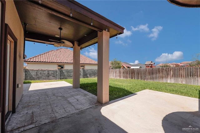 3705 Joycee Dr, Mission, TX 78572 - fenced backyard featuring a patio and ceiling fan