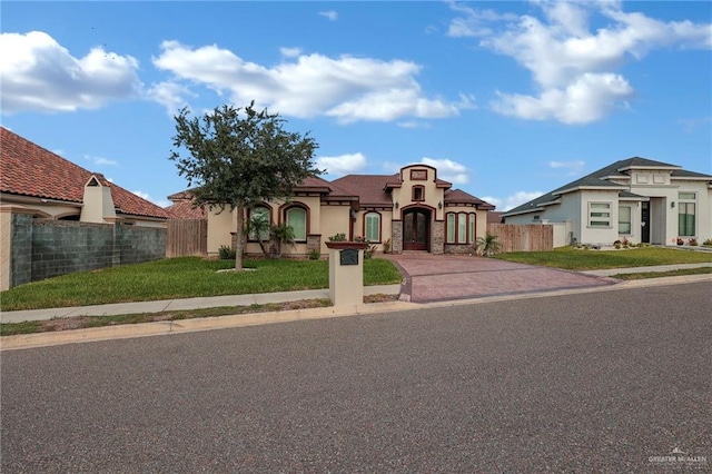 3705 Joycee Dr, Mission, TX 78572 - mediterranean / spanish-style house featuring stucco siding and concrete driveway