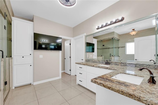 3705 Joycee Dr, Mission, TX 78572 - full bathroom with double vanity, a shower stall, and tile patterned flooring