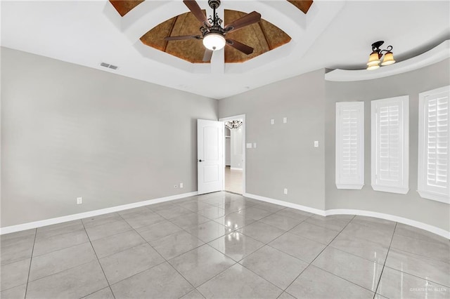 3705 Joycee Dr, Mission, TX 78572 - empty room featuring a tray ceiling, tile patterned floors, and a ceiling fan