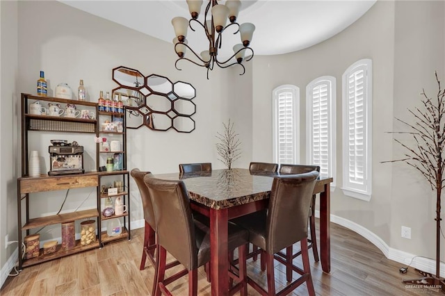3705 Joycee Dr, Mission, TX 78572 - dining room featuring a chandelier and light wood-style flooring
