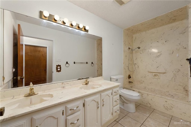 509 Lincoln Ln, La Feria, TX 78559 - full bathroom featuring double vanity, shower / tub combination, toilet, tile patterned flooring, and a textured ceiling