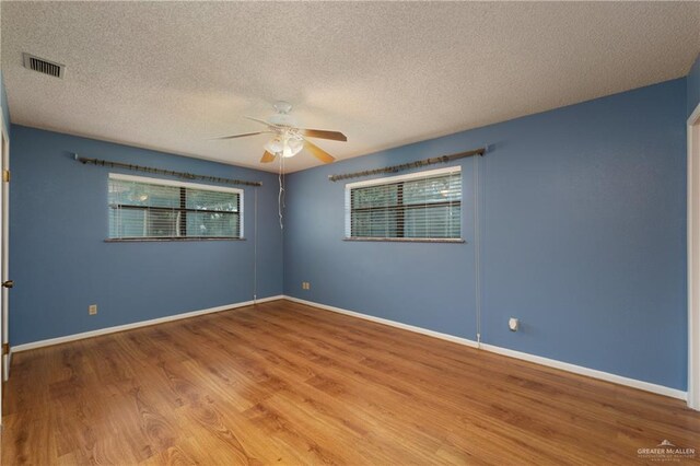509 Lincoln Ln, La Feria, TX 78559 - empty room featuring a ceiling fan, wood finished floors, a textured ceiling, and baseboards