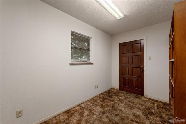 509 Lincoln Ln, La Feria, TX 78559 - foyer entrance featuring carpet flooring, a textured ceiling, and baseboards