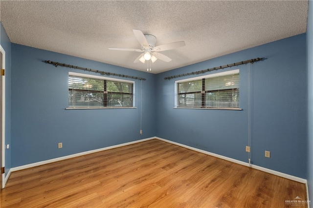 509 Lincoln Ln, La Feria, TX 78559 - empty room with wood finished floors, ceiling fan, a textured ceiling, and baseboards