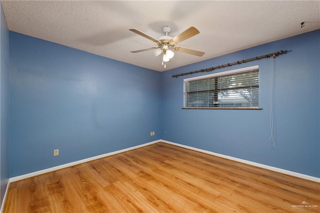 509 Lincoln Ln, La Feria, TX 78559 - unfurnished room featuring wood finished floors, baseboards, a textured ceiling, and ceiling fan
