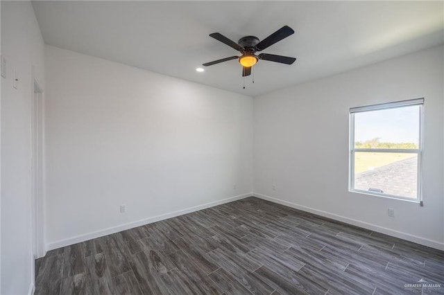 unfurnished room featuring ceiling fan and dark hardwood / wood-style flooring