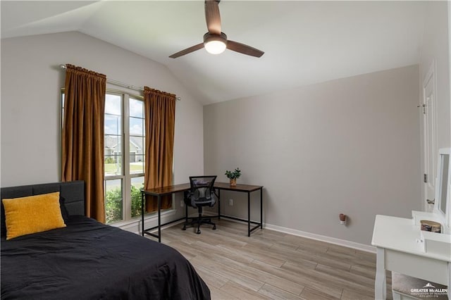 bedroom with lofted ceiling, baseboards, light wood-type flooring, and ceiling fan