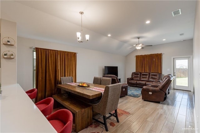 dining room with lofted ceiling, light wood-style flooring, recessed lighting, and visible vents