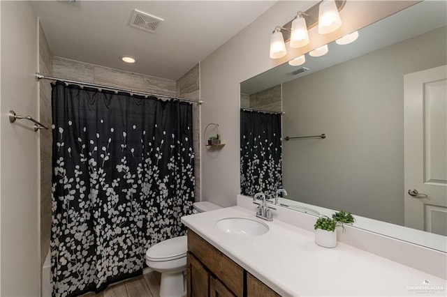 full bath with visible vents, toilet, and a shower with curtain