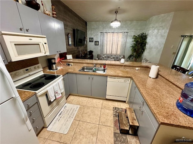 kitchen with white appliances, sink, hanging light fixtures, gray cabinets, and kitchen peninsula