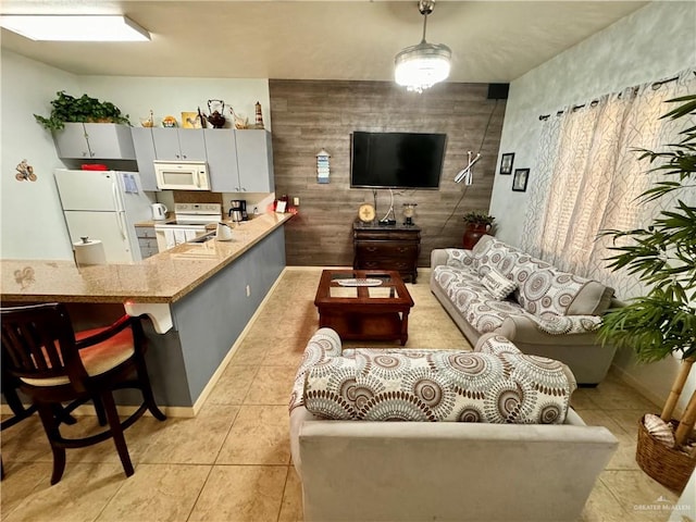 living room featuring light tile patterned flooring