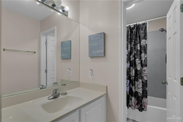 bathroom featuring vanity and shower / bath combination with curtain