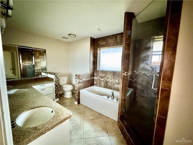 1311 Anahi St, Alamo, TX 78516 - bathroom featuring a garden tub, double vanity, a stall shower, toilet, and tile patterned floors