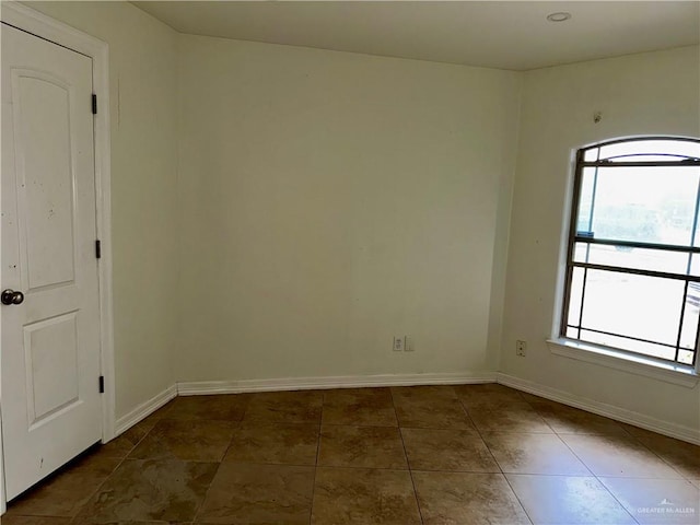 1311 Anahi St, Alamo, TX 78516 - empty room featuring baseboards and tile patterned floors